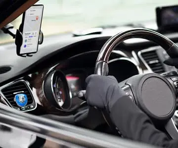 A hand of driver and steering wheel